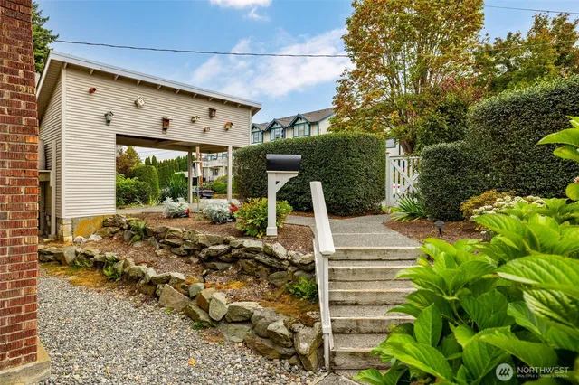 a view of a porch with furniture and garden