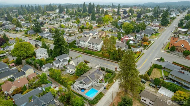 an aerial view of residential houses with outdoor space