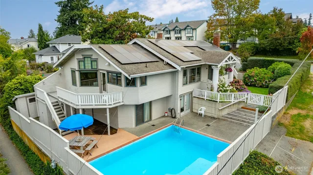 a view of a patio with a table and chairs