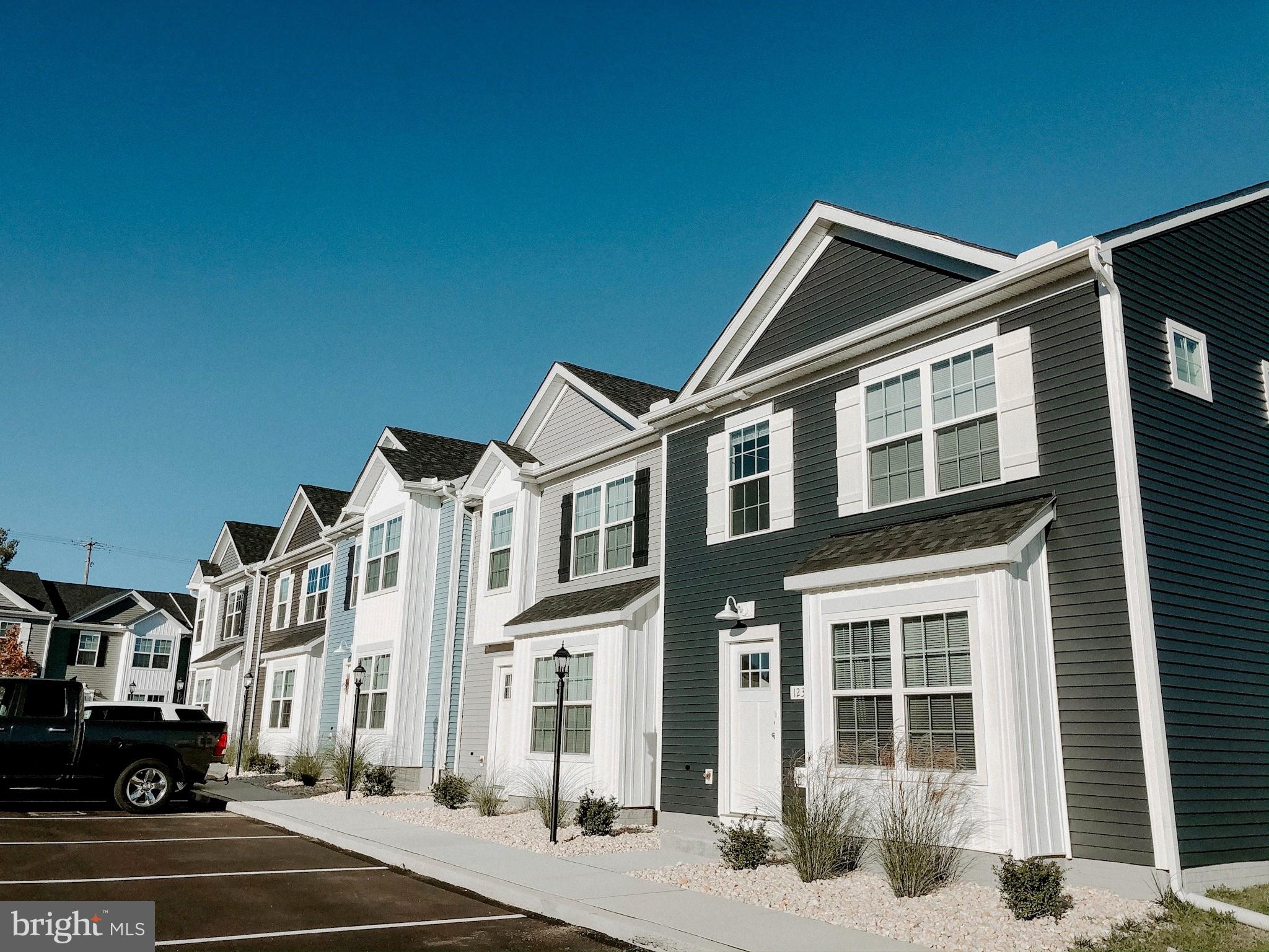 51 Overlook Dr., Unit J Hanover, PA 17331 - Photo 1 of 13 a front view of a building with parking space and traffic signal