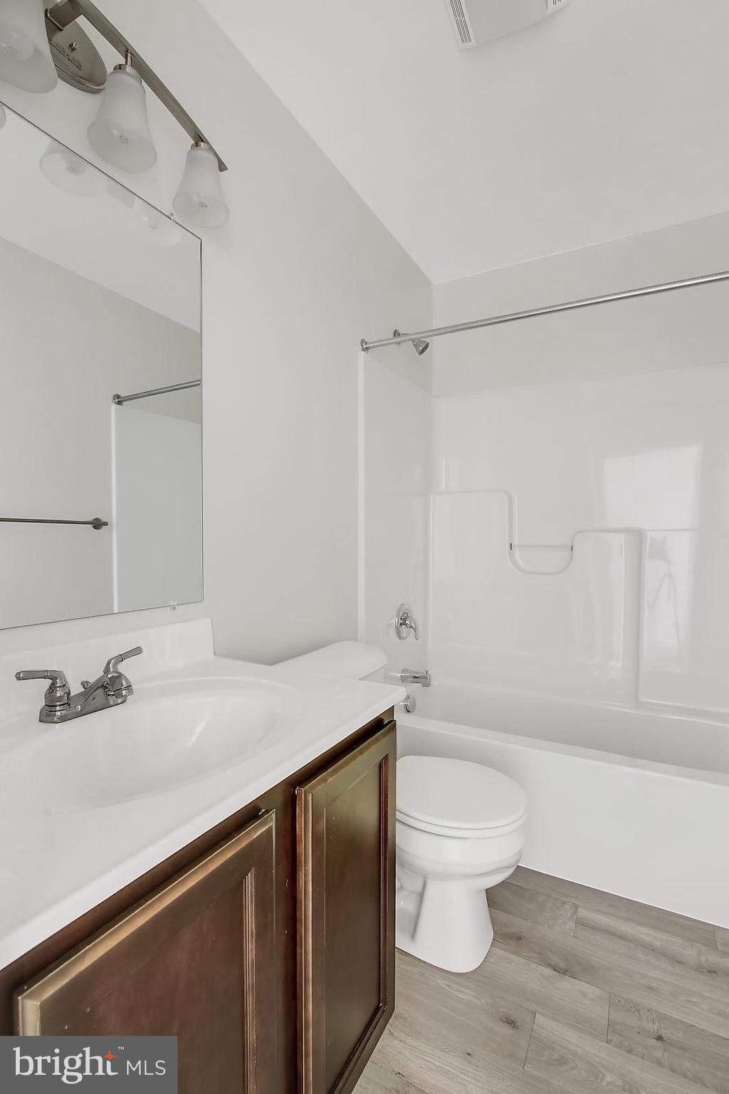 51 Overlook Dr., Unit J Hanover, PA 17331 - Photo 8 of 13 a bathroom with a sink a toilet and shower