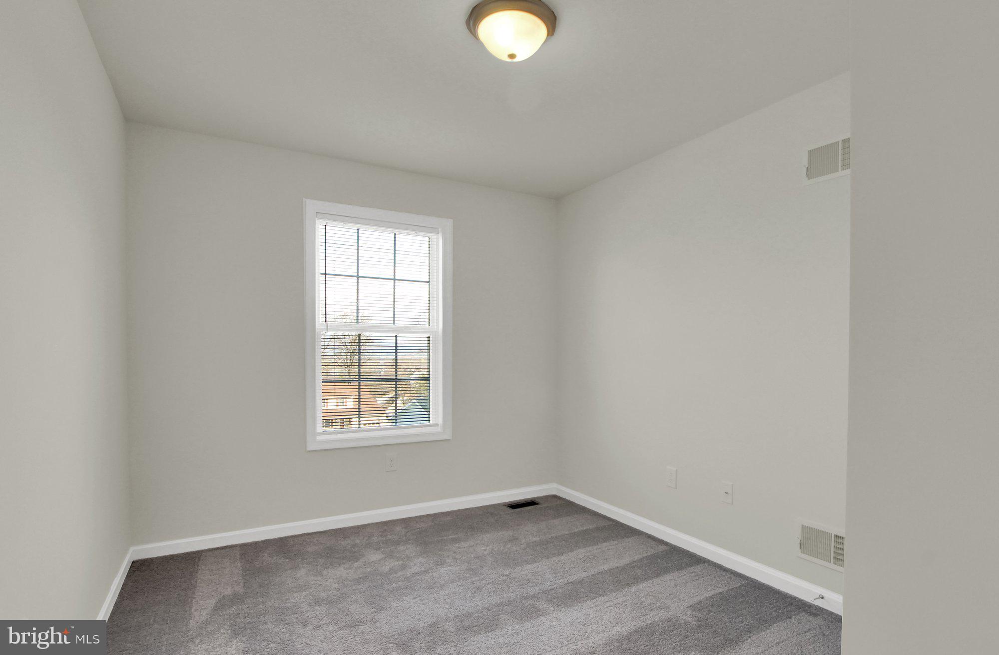 51 Overlook Dr., Unit J Hanover, PA 17331 - Photo 9 of 13 an empty room with window and window