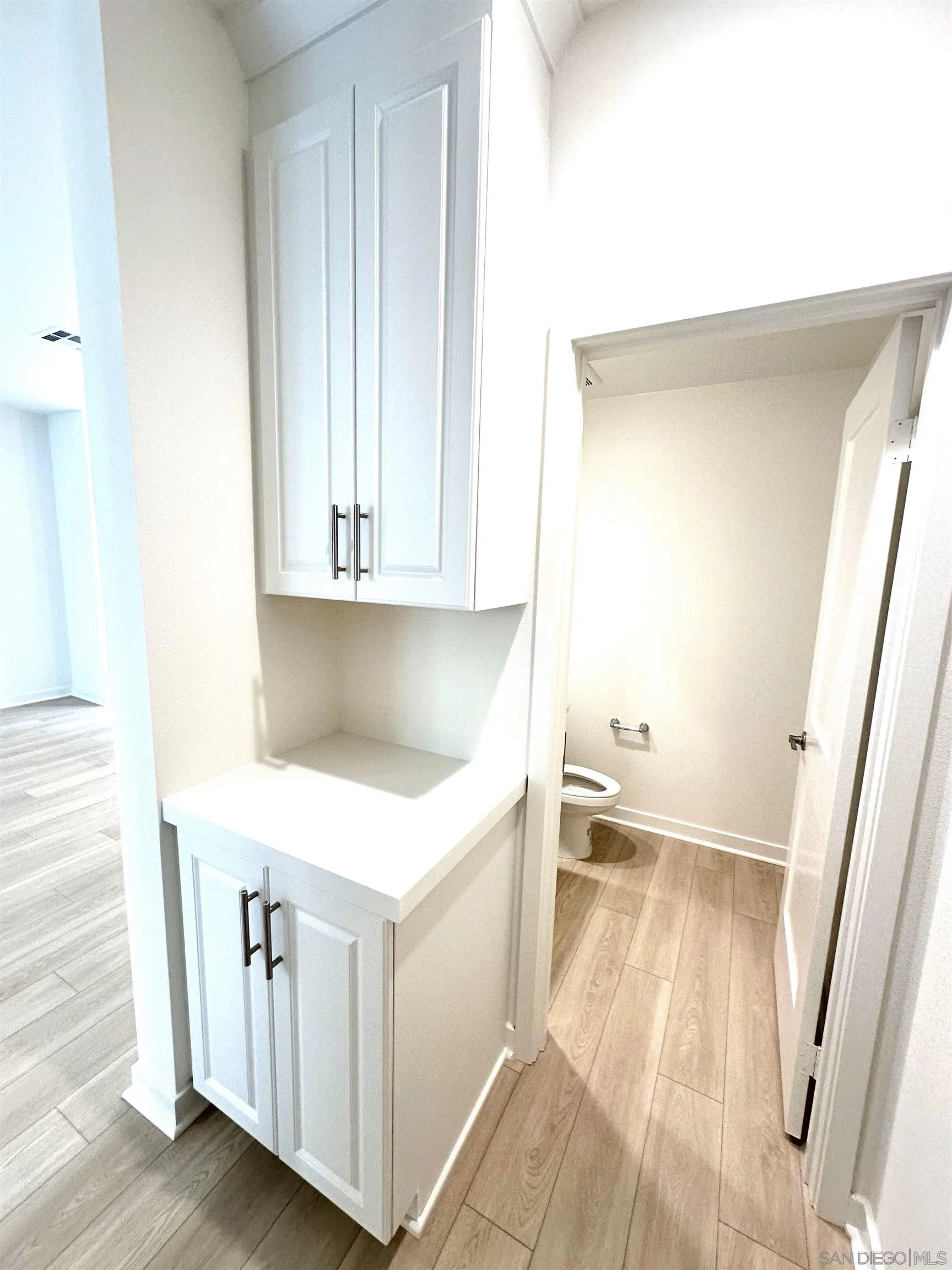 2511 Chamomile Lane Carlsbad, CA 92008 - Photo 13 of 51 a hallway view with wooden floor