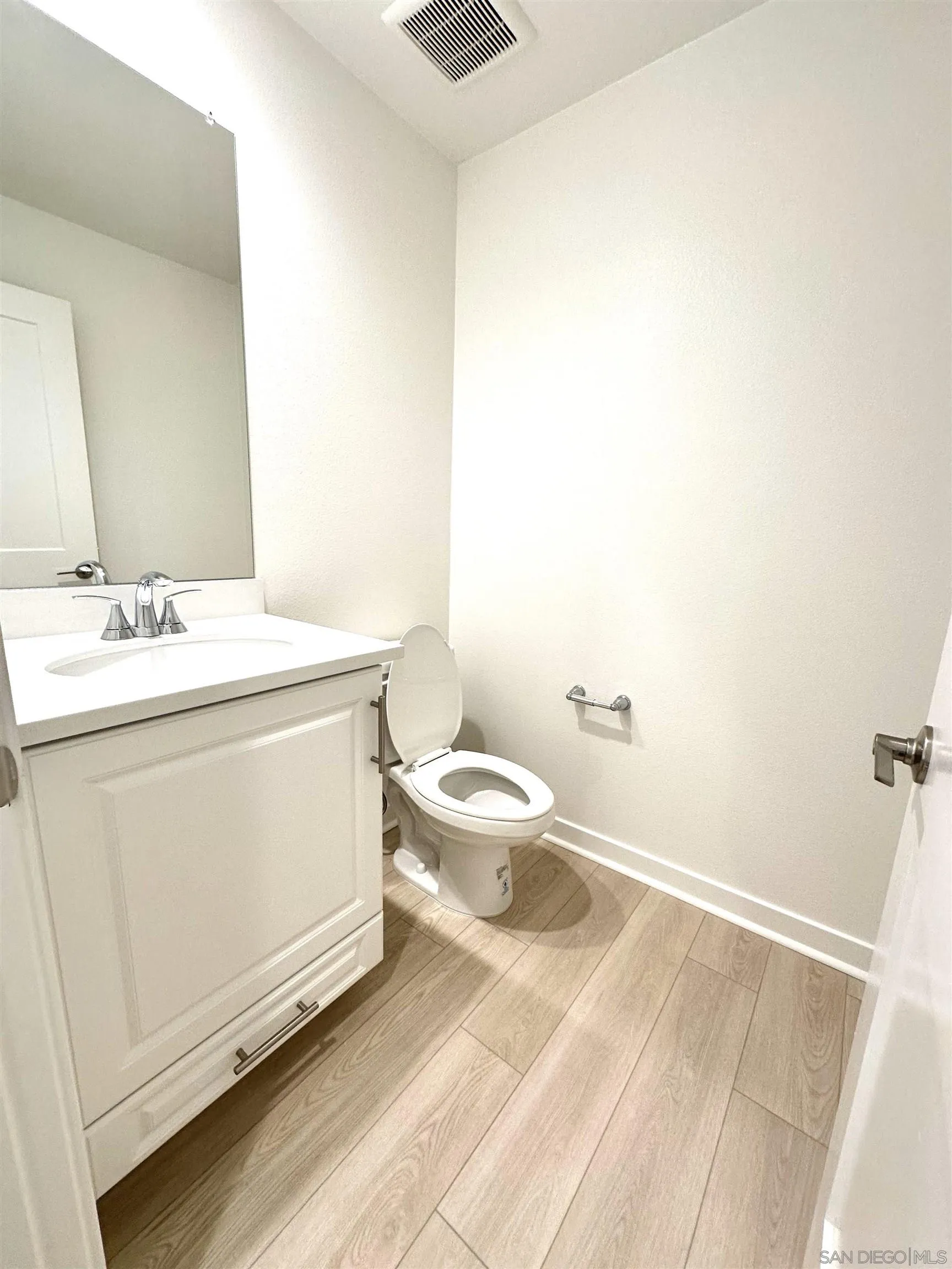 2511 Chamomile Lane Carlsbad, CA 92008 - Photo 14 of 51 a bathroom with a sink a toilet and a mirror