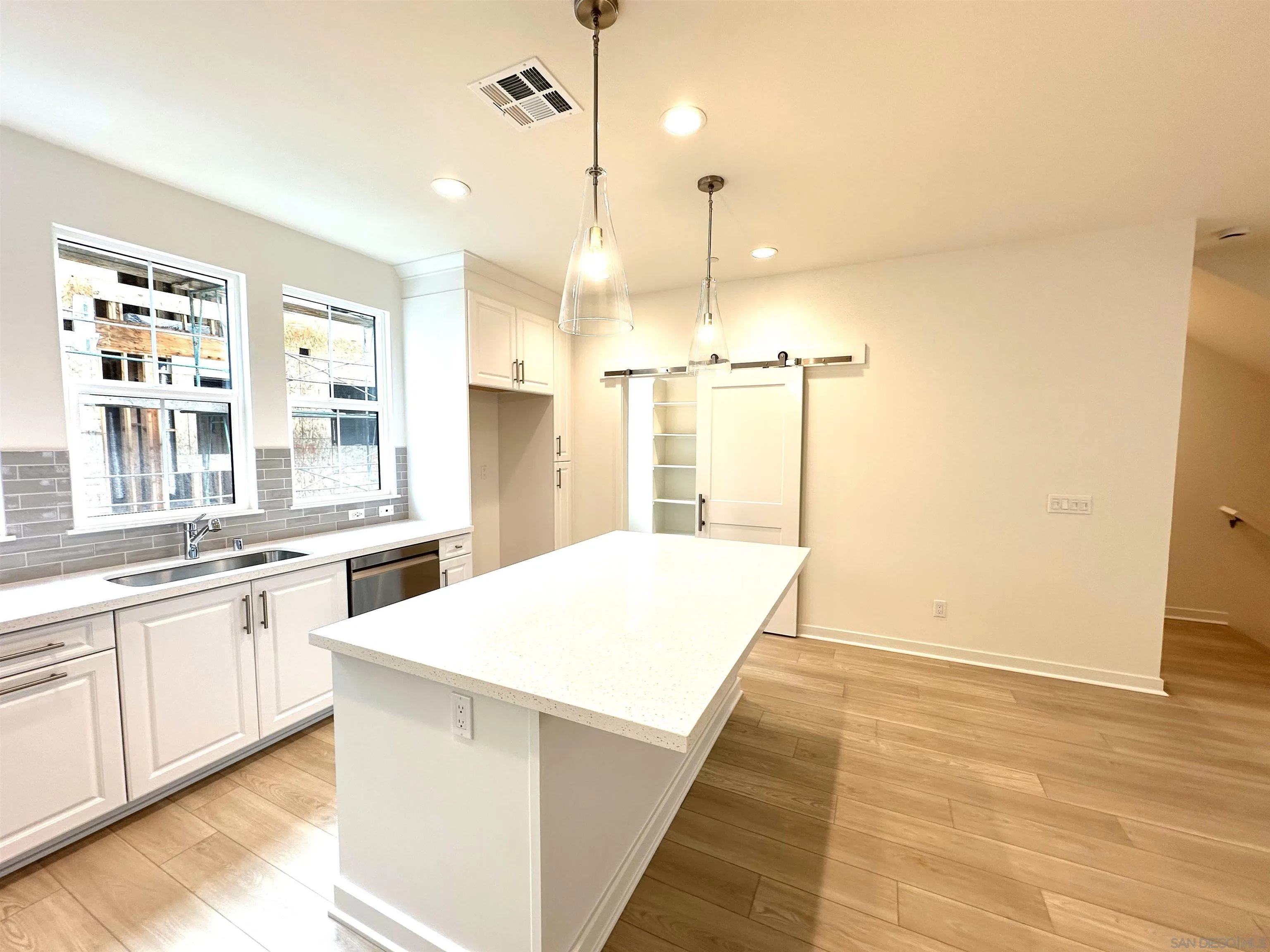 2511 Chamomile Lane Carlsbad, CA 92008 - Photo 17 of 51 a large kitchen with kitchen island a sink stainless steel appliances and cabinets