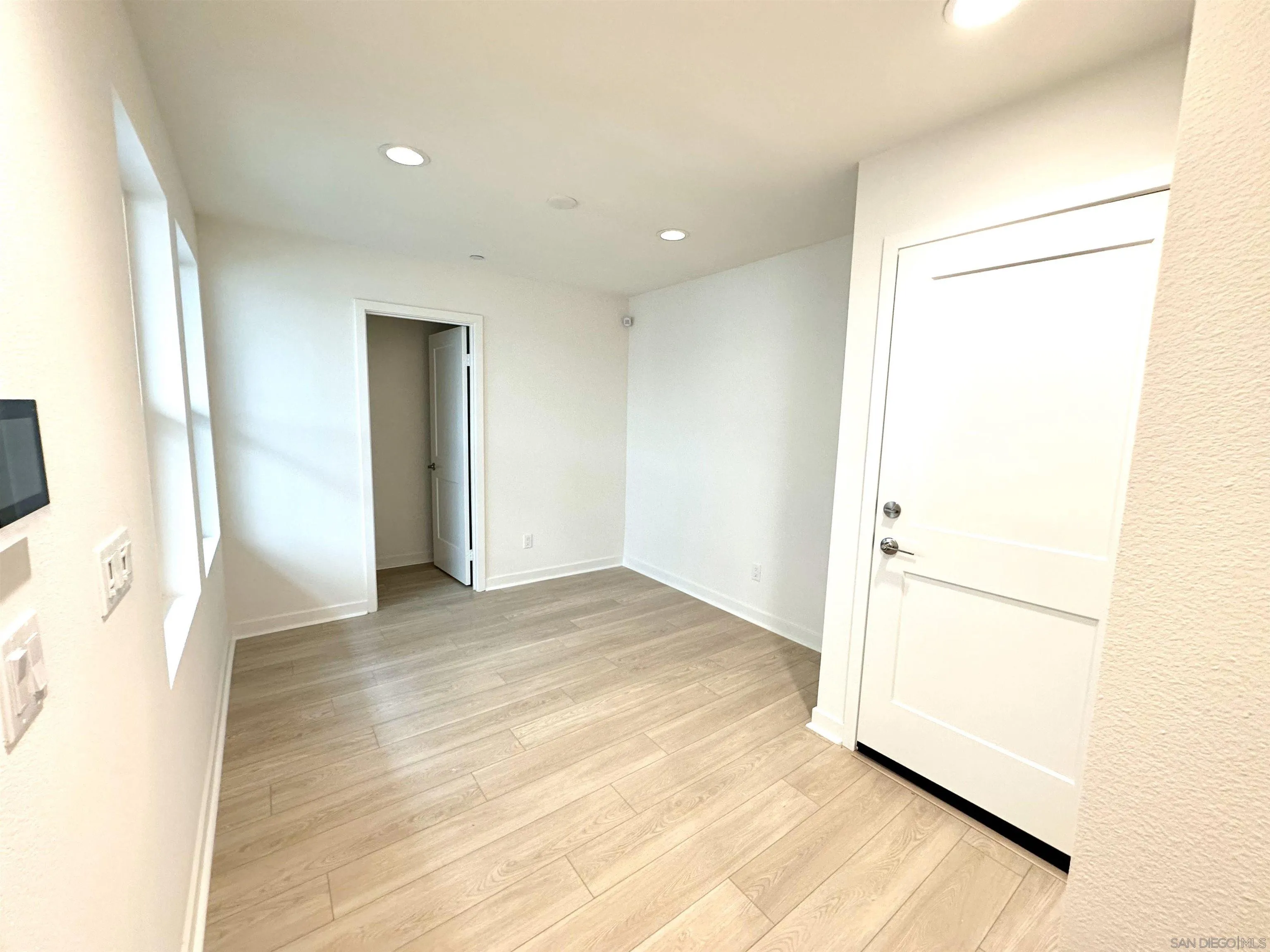 2511 Chamomile Lane Carlsbad, CA 92008 - Photo 19 of 51 a view of empty room with wooden floor