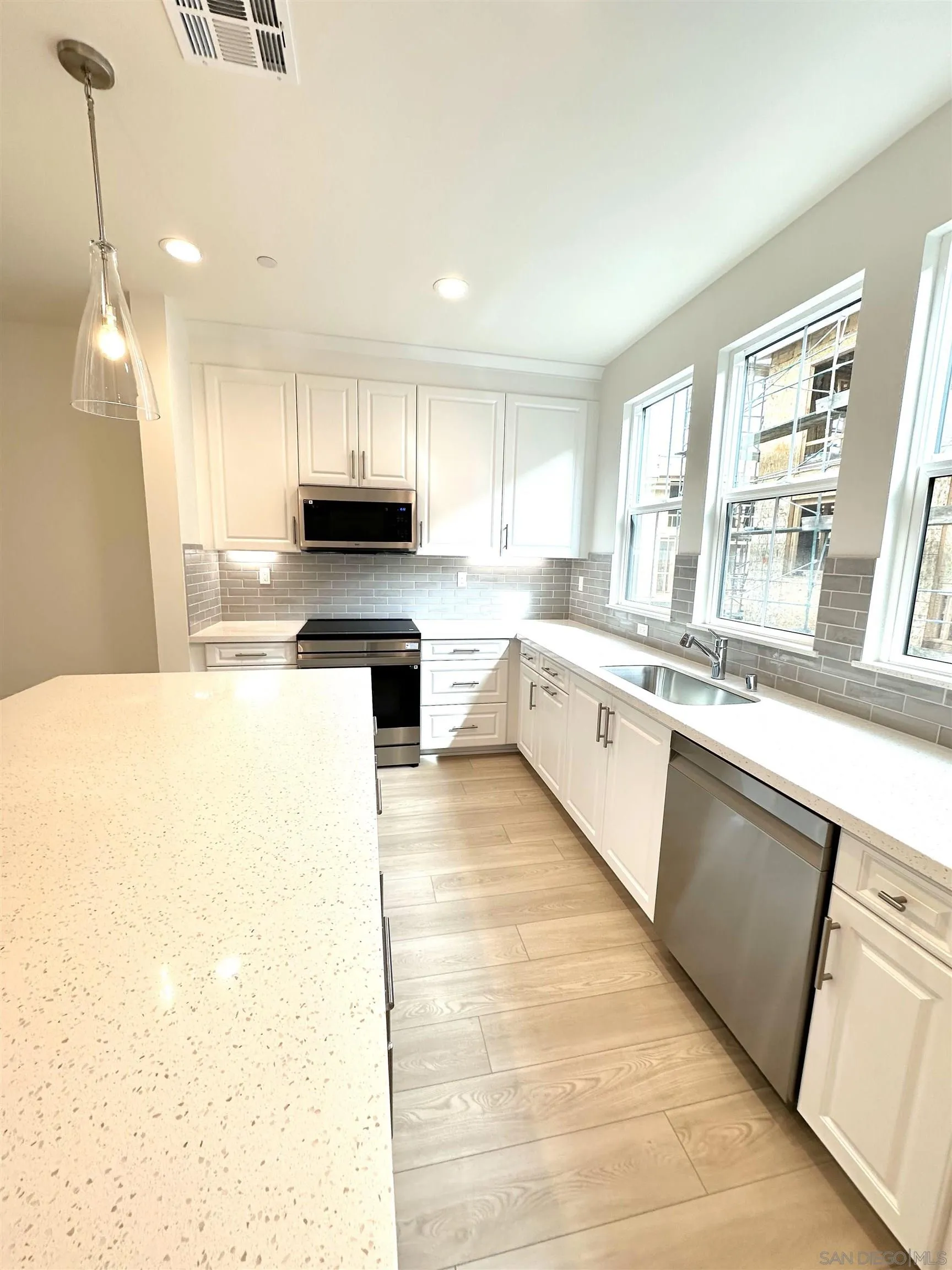 2511 Chamomile Lane Carlsbad, CA 92008 - Photo 2 of 51 a kitchen with stainless steel appliances granite countertop a stove a sink and a refrigerator