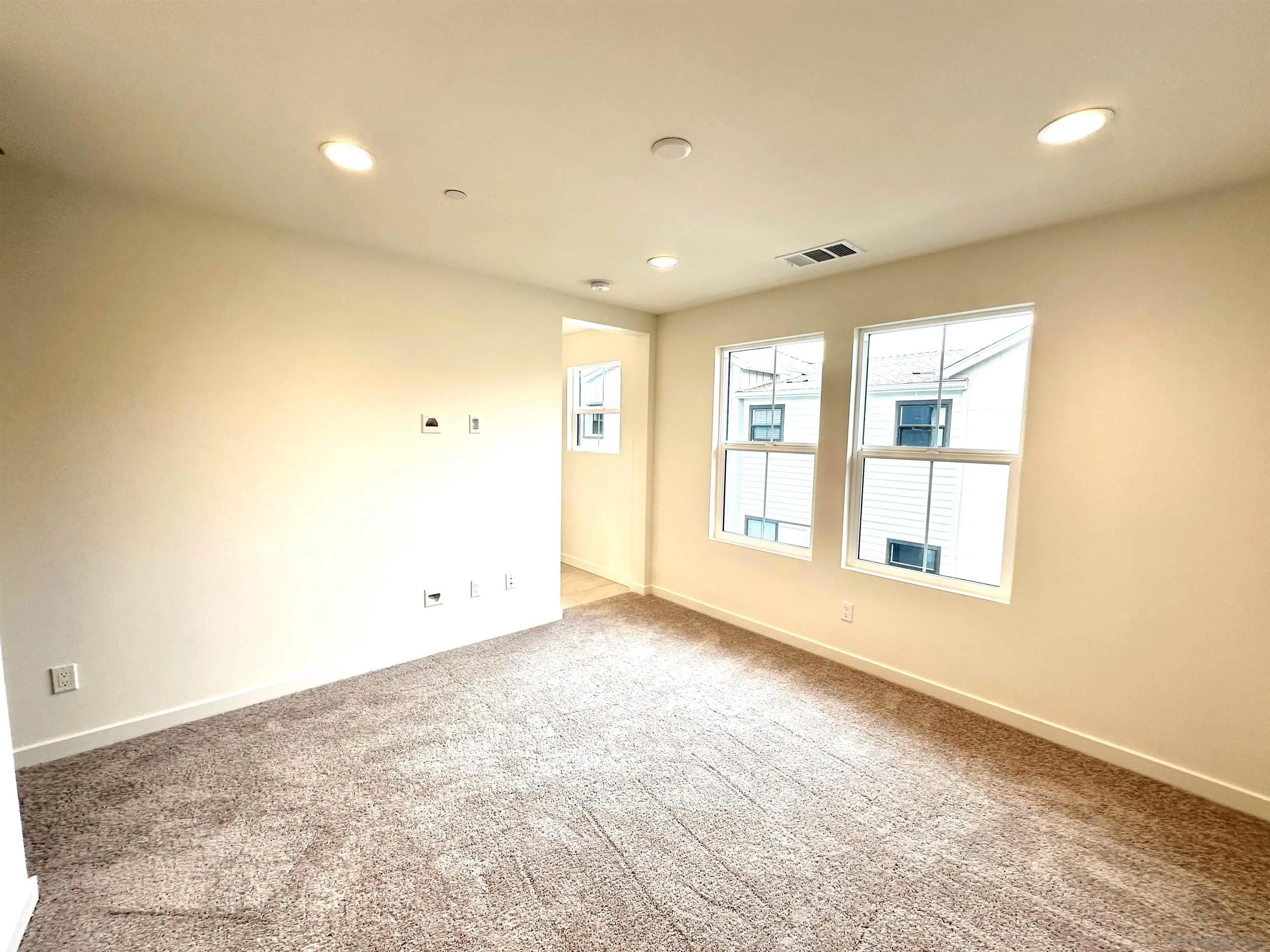 2511 Chamomile Lane Carlsbad, CA 92008 - Photo 32 of 51 a view of an empty room with a window