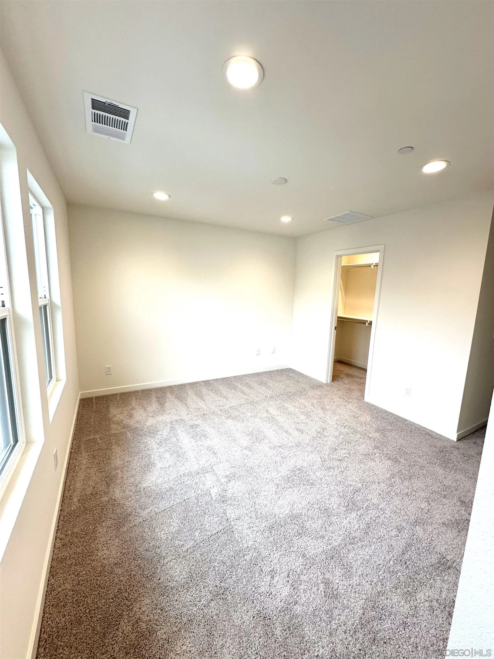 2511 Chamomile Lane Carlsbad, CA 92008 - Photo 36 of 51 an empty room with a natural light