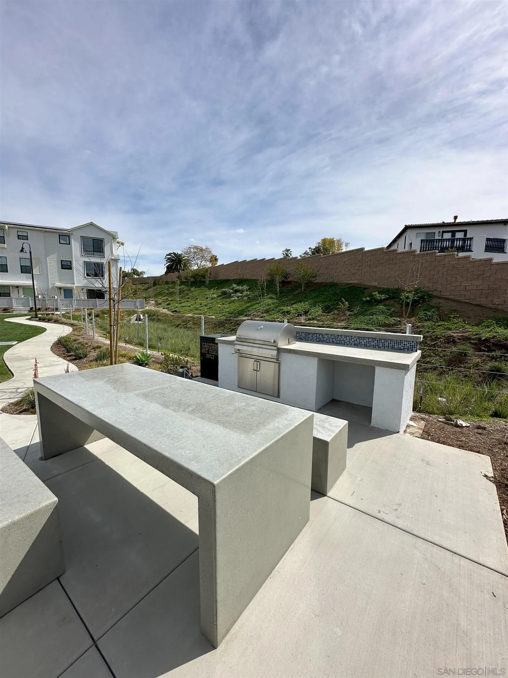 2511 Chamomile Lane Carlsbad, CA 92008 - Photo 50 of 51 a view of a terrace with a table and chairs