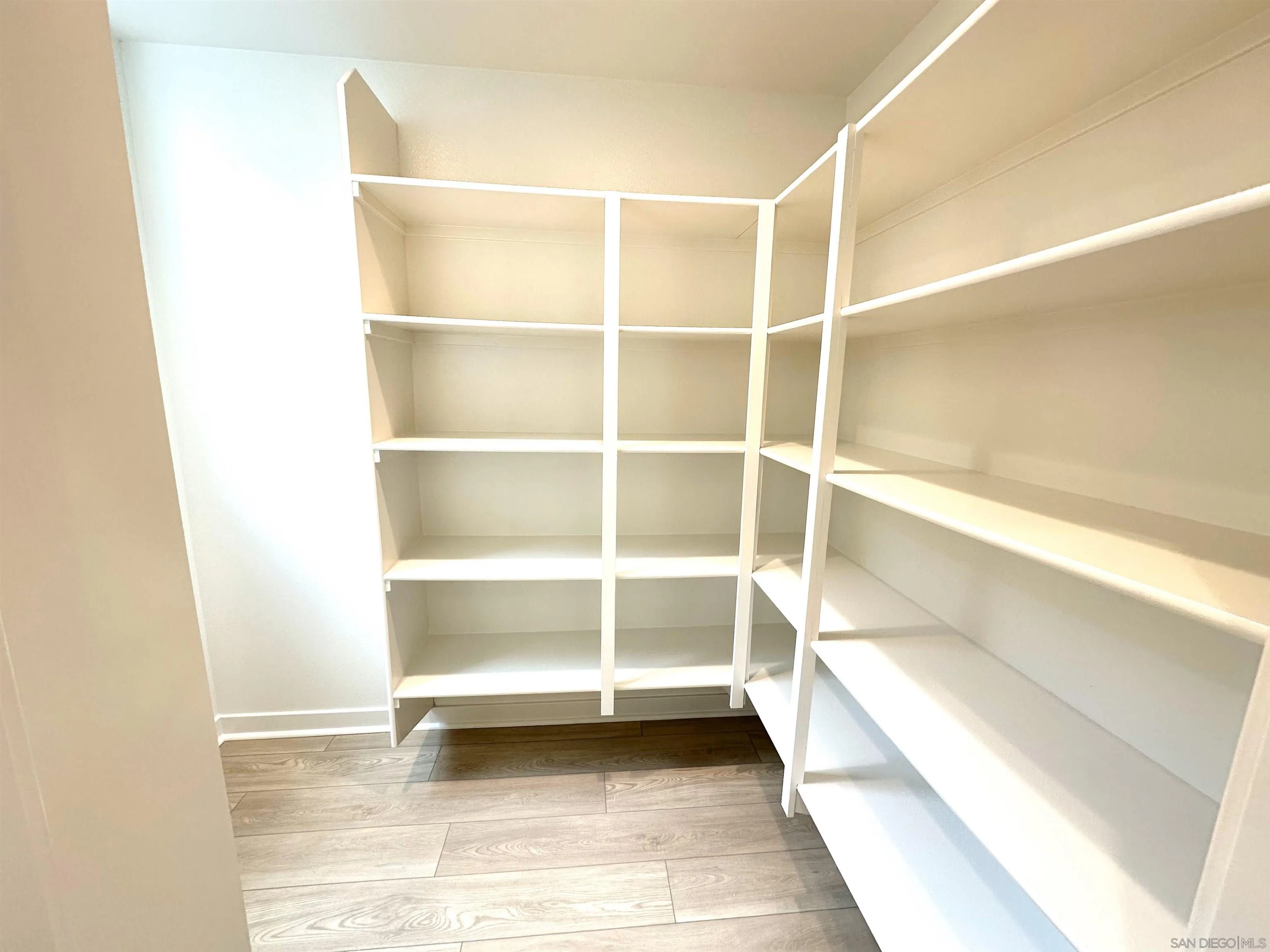 2511 Chamomile Lane Carlsbad, CA 92008 - Photo 5 of 51 a view of a room with shelves on the wall