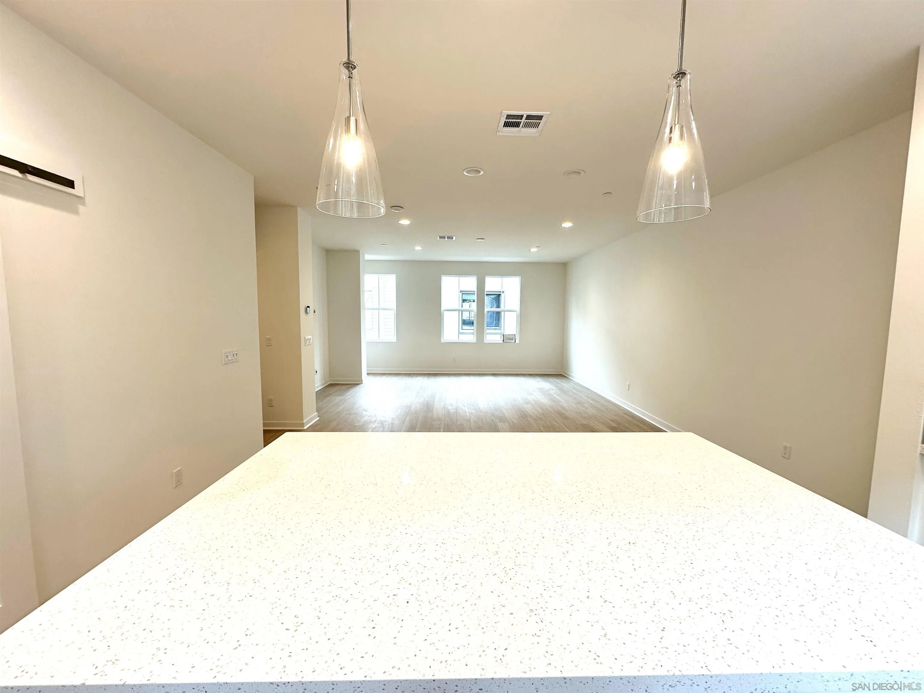 2511 Chamomile Lane Carlsbad, CA 92008 - Photo 8 of 51 a bedroom with a bed and a chandelier