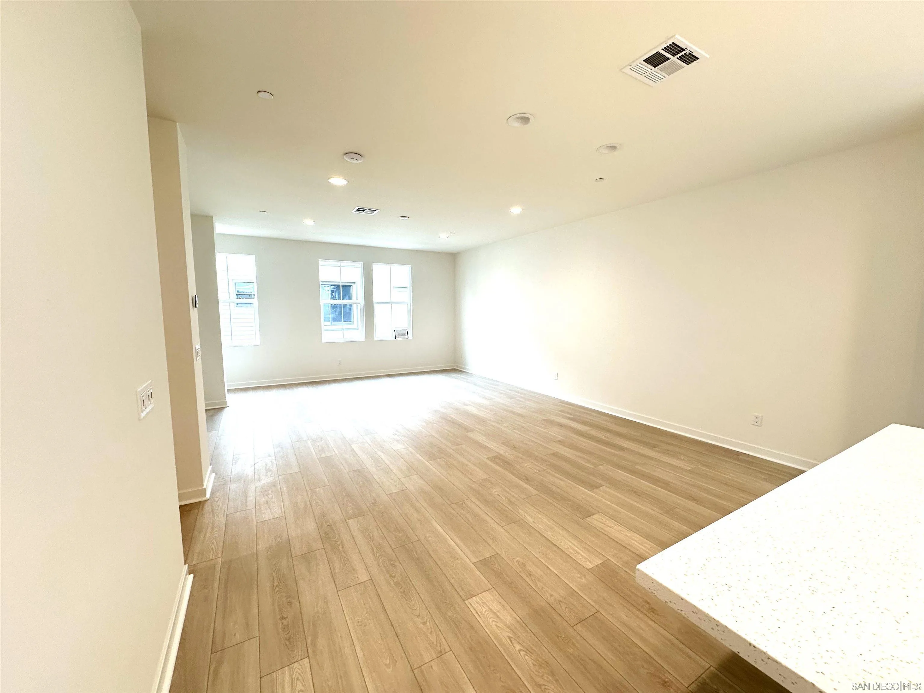 2511 Chamomile Lane Carlsbad, CA 92008 - Photo 9 of 51 a view of empty room with wooden floor