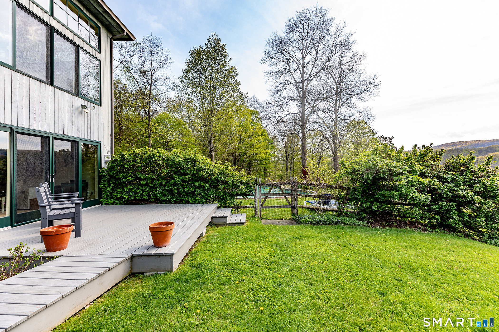 16 Anderson Acres Road Kent, CT 06785 - Photo 35 of 40 a view of a swimming pool with a bench and trees