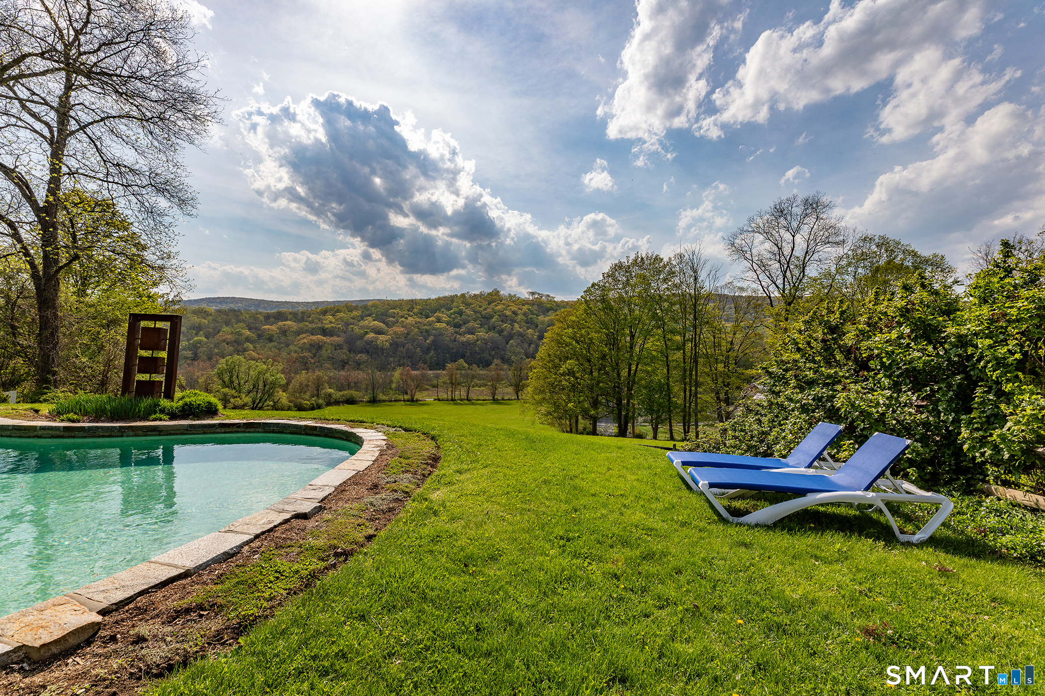 16 Anderson Acres Road Kent, CT 06785 - Photo 5 of 40 a view of a swimming pool with a garden and trees