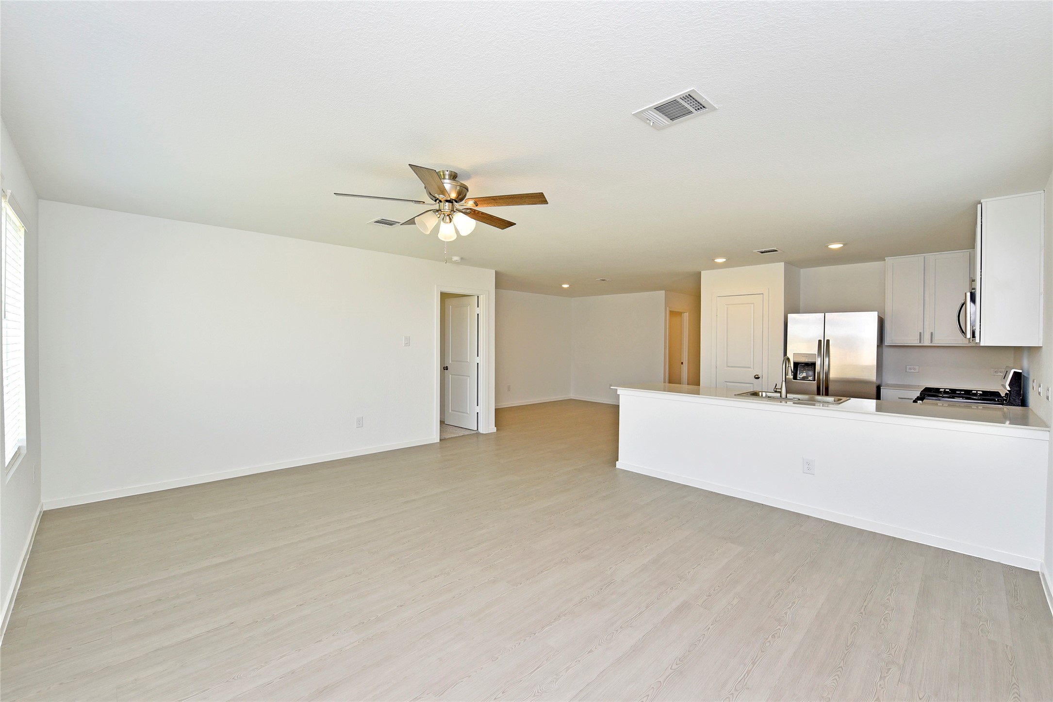 10218 Prairie Dunes Lane Cleveland, TX 77327 - Photo 5 of 32 a view of a kitchen with a sink