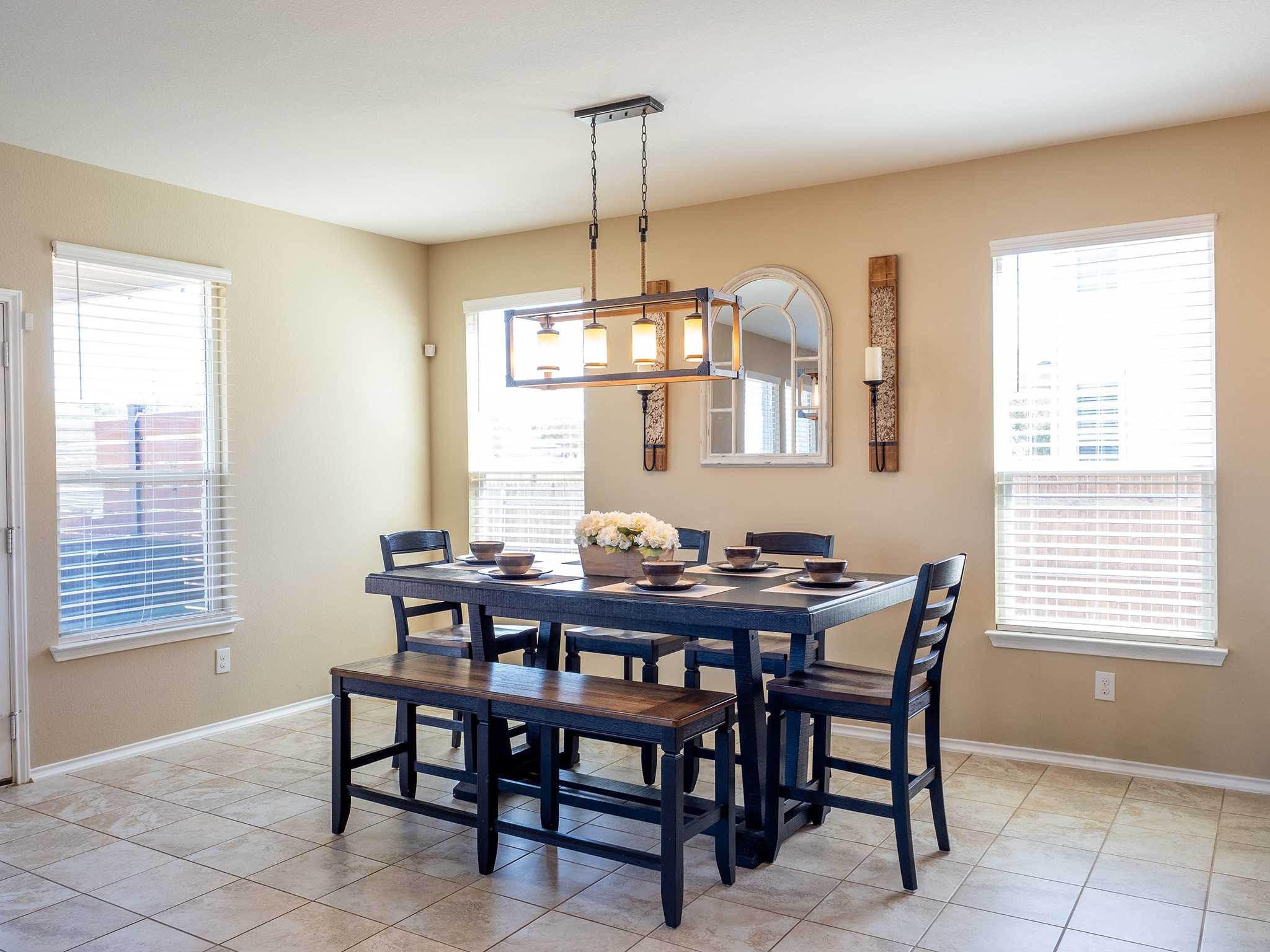 104 Rocroi Drive Georgetown, TX 78626 - Photo 7 of 40 Tile flooring and multiple windows organize this comfortable dining space.