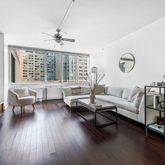 a living room with fireplace furniture and a flat screen tv