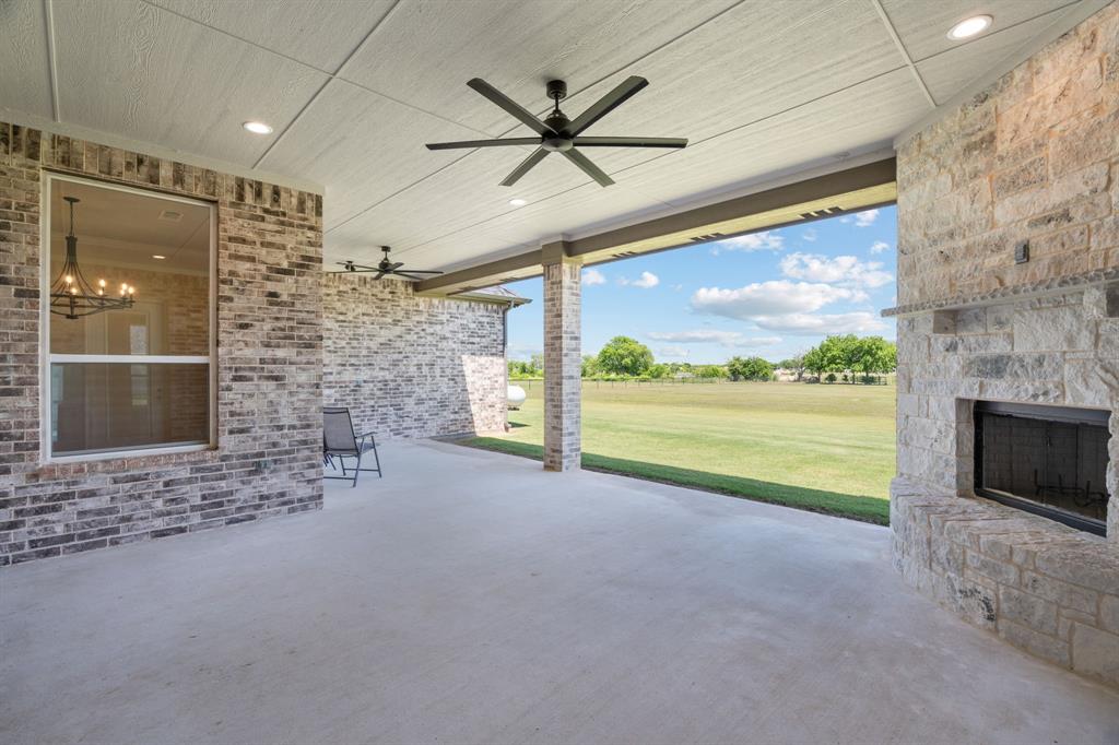 161 Frontera Drive Decatur, TX 76234 - Photo 31 of 39 Great Covered, Open Patio Space with Ceiling Fan & Fireplace