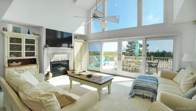 a living room with furniture fireplace and a flat screen tv