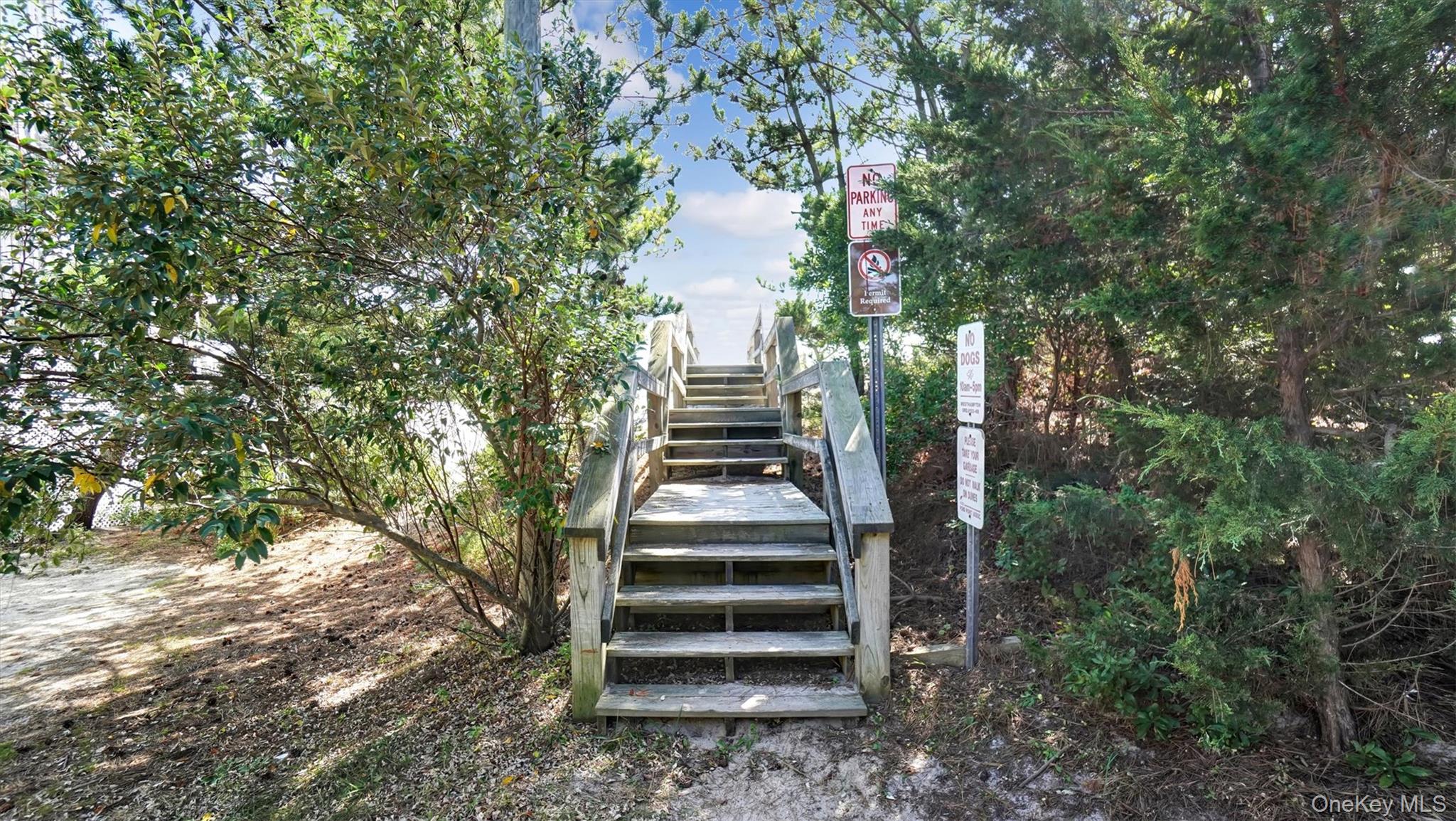 431 Dune Road Westhampton Beach, NY 11978 - Photo 19 of 27 a front view of a house with a yard