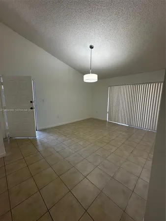an empty room with a fireplace