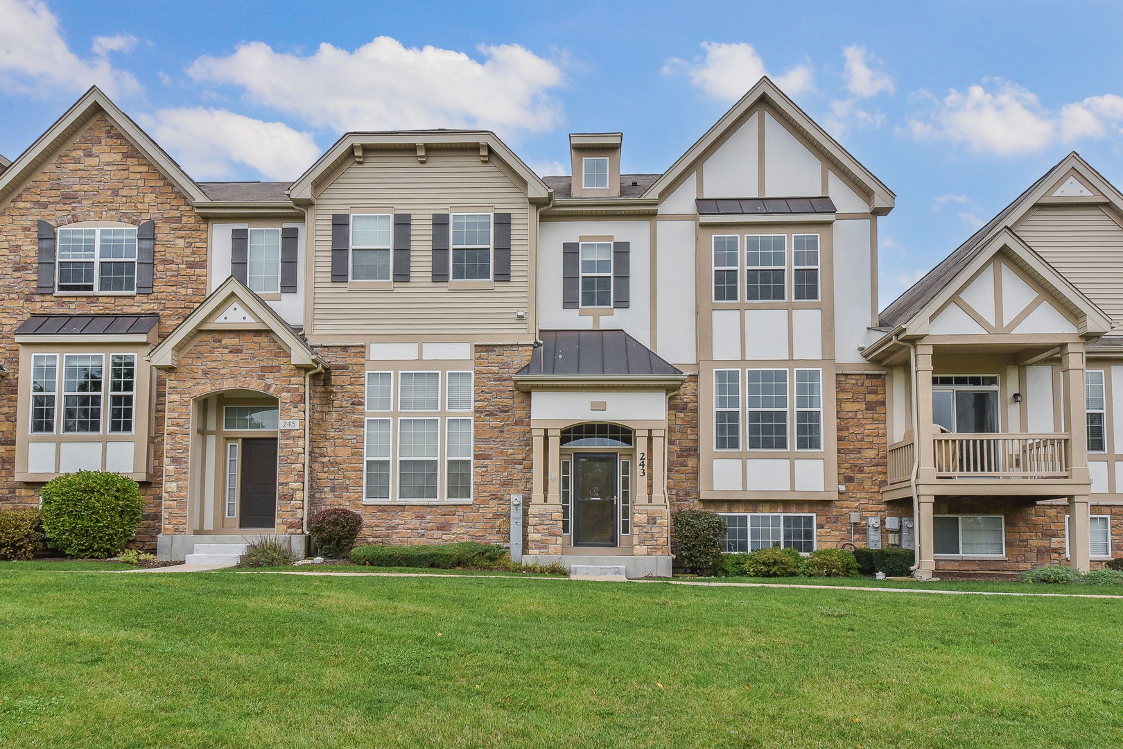 a front view of a house with a yard