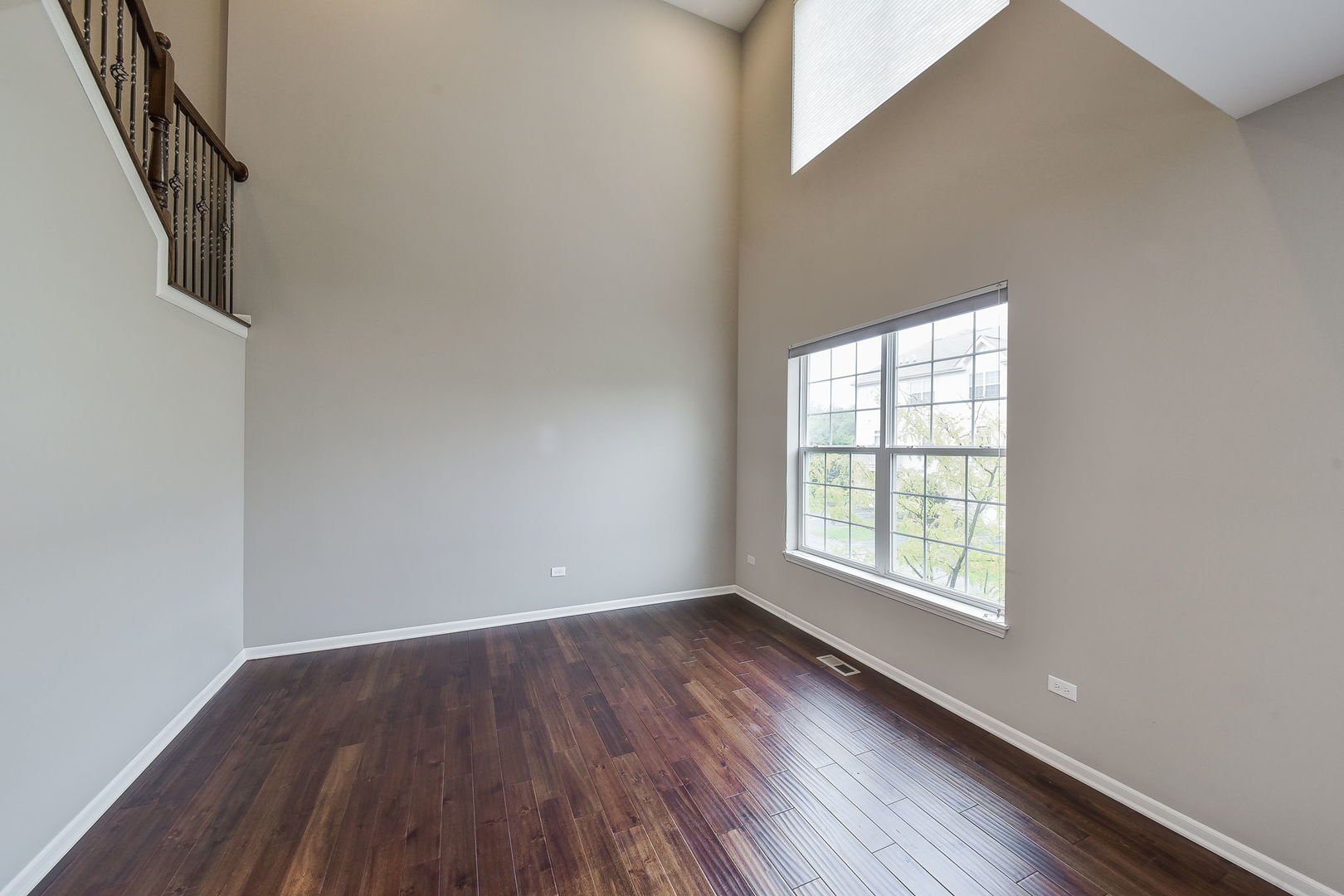 243 Bennett Drive Carol Stream, IL 60188 - Photo 11 of 23 an empty room with wooden floor and windows