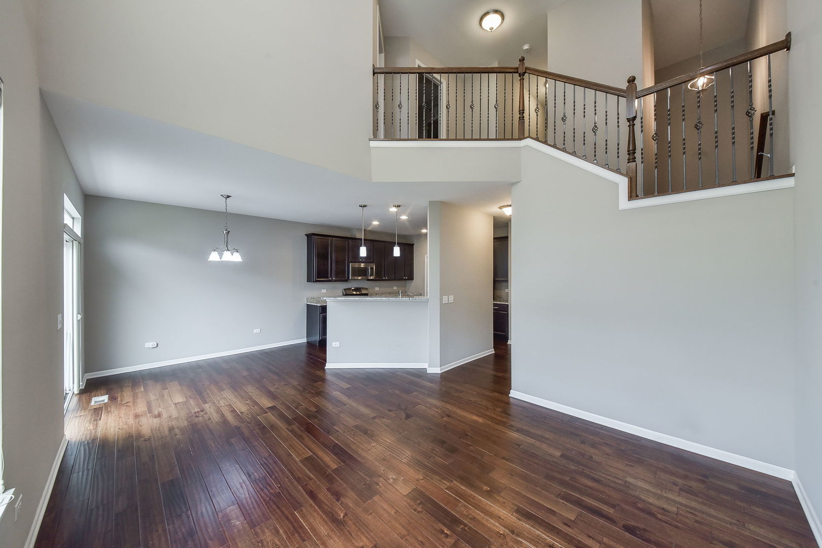 243 Bennett Drive Carol Stream, IL 60188 - Photo 12 of 23 a view of an empty room with wooden floor