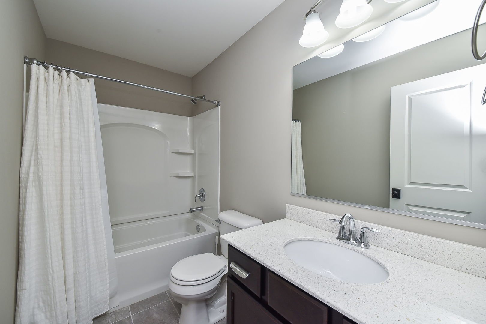 243 Bennett Drive Carol Stream, IL 60188 - Photo 16 of 23 a bathroom with a sink a toilet and shower