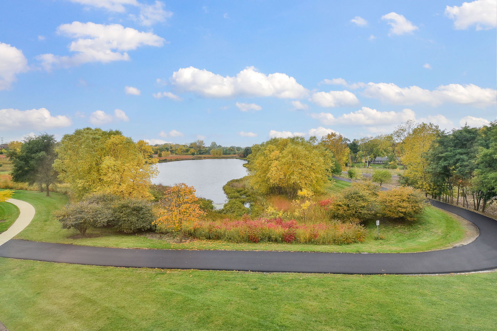 243 Bennett Drive Carol Stream, IL 60188 - Photo 23 of 23 a view of a lake with a house in the background