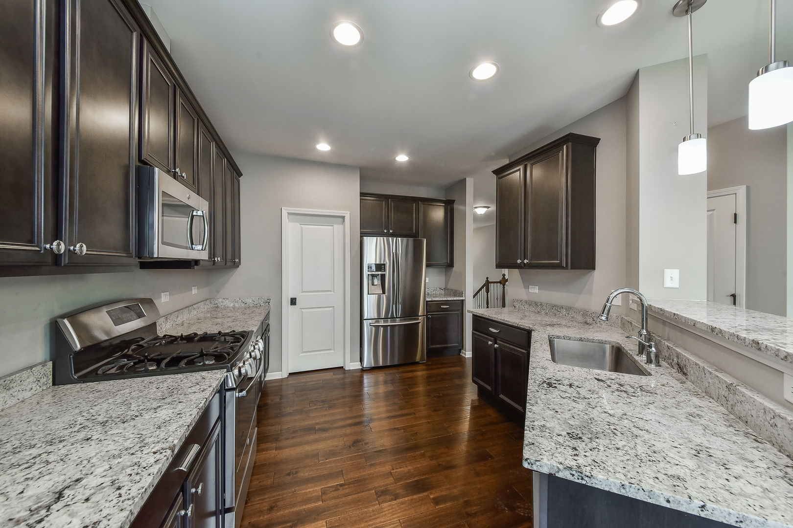 243 Bennett Drive Carol Stream, IL 60188 - Photo 4 of 23 a large kitchen with stainless steel appliances granite countertop a granite counter tops and a stove