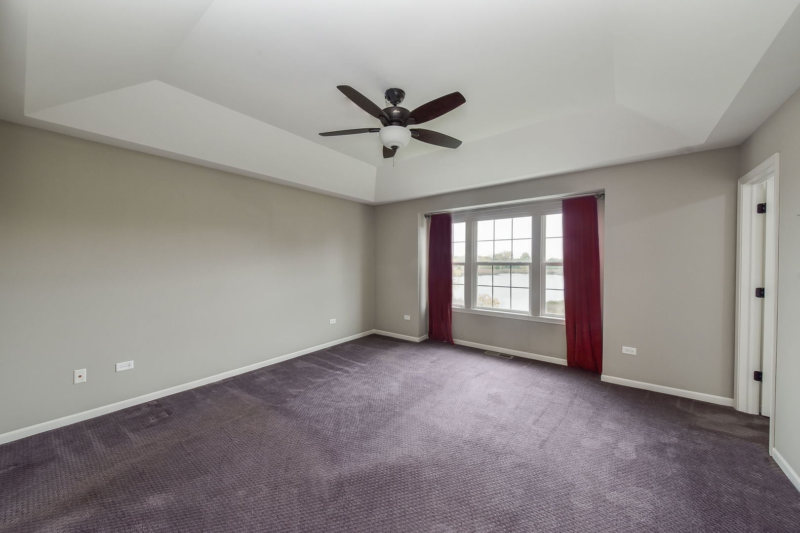 243 Bennett Drive Carol Stream, IL 60188 - Photo 6 of 23 a view of a livingroom with a ceiling fan and window