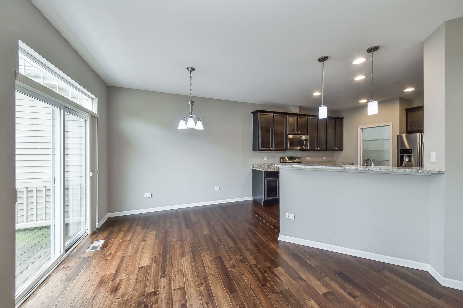 243 Bennett Drive Carol Stream, IL 60188 - Photo 9 of 23 a view of a kitchen with a sink and microwave