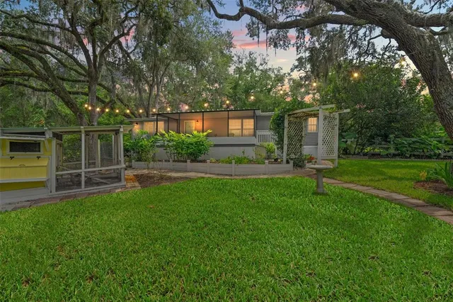 a backyard of a house with lots of green space