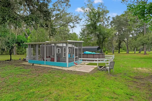 a living room with furniture and a yard