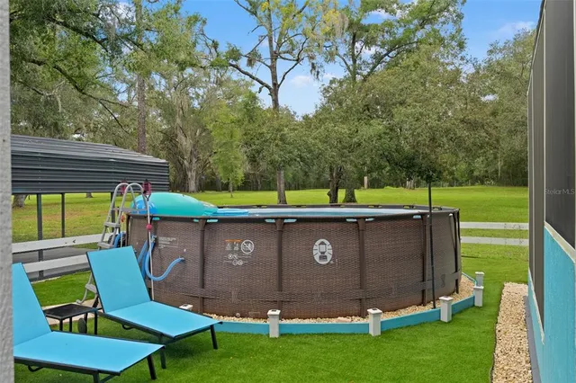 a view of a backyard with a garden and plants