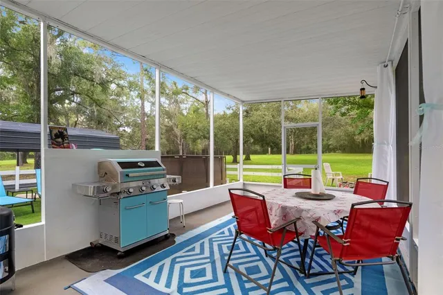 a view of a house with a yard porch and sitting area