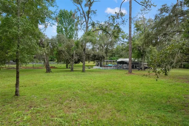 a view of outdoor space with deck and yard