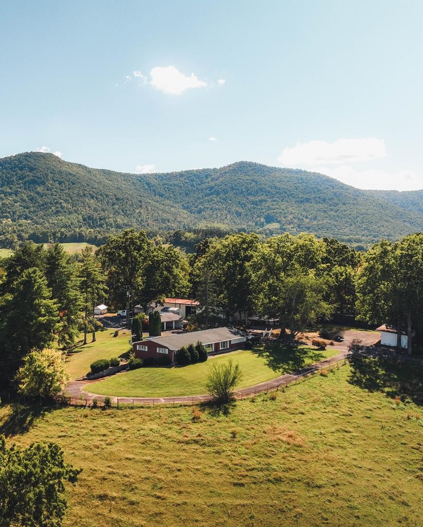 201 County Line Road Dandridge, TN 37725 - Photo 22 of 23 a view of a lake with a mountain in the background