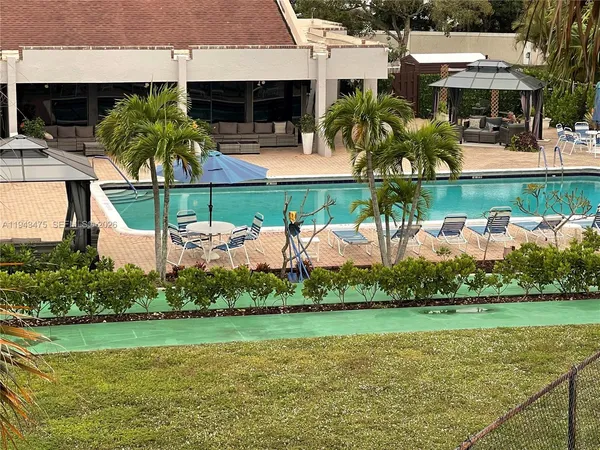a view of a swimming pool with a patio