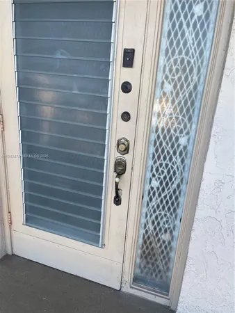 a bathroom with a glass door shower