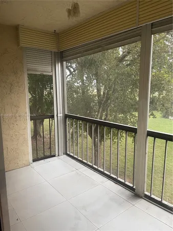 a view of a glass door with a balcony