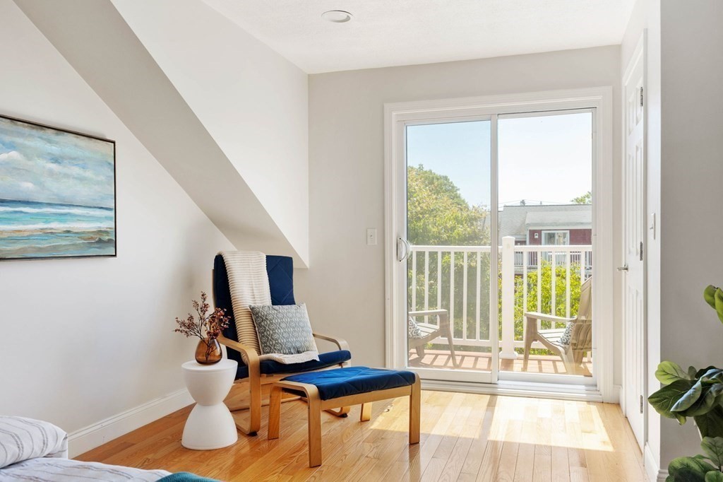 40 Brattle Street, Unit 7 Arlington, MA 02476 - Photo 14 of 25 a living room with furniture and floor to ceiling windows