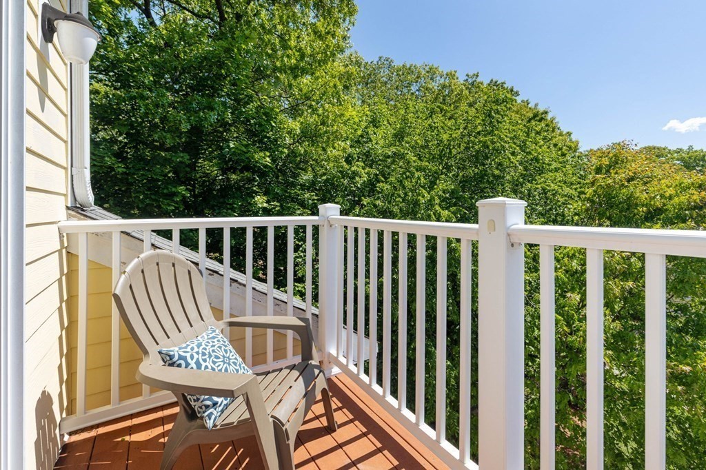 40 Brattle Street, Unit 7 Arlington, MA 02476 - Photo 15 of 25 a view of balcony with wooden floor and outdoor seating
