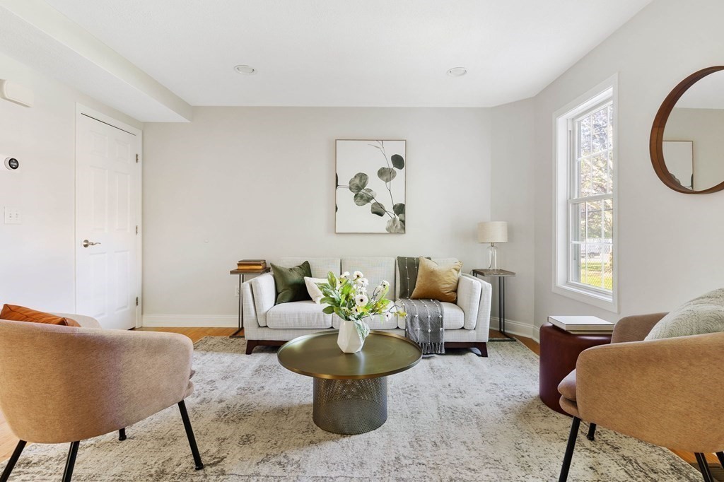 40 Brattle Street, Unit 7 Arlington, MA 02476 - Photo 3 of 25 a living room with furniture and a large window