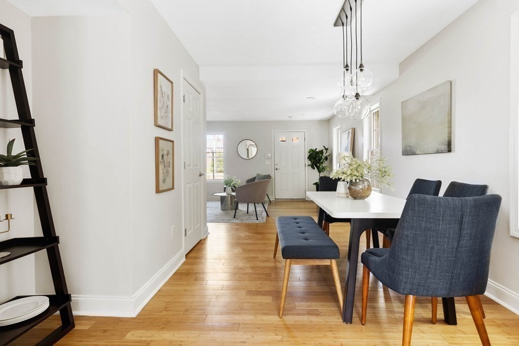 40 Brattle Street, Unit 7 Arlington, MA 02476 - Photo 5 of 25 a view of a dining room with furniture and wooden floor