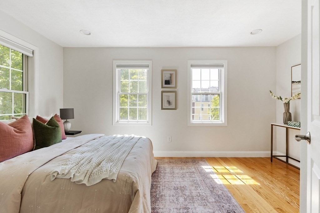 40 Brattle Street, Unit 7 Arlington, MA 02476 - Photo 9 of 25 a bedroom with a bed and a window
