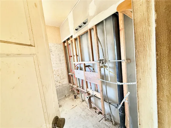 an empty room with a empty space and windows