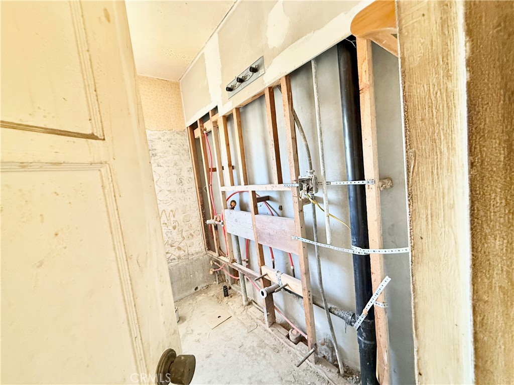 13807 Carson Street Trona, CA 93562 - Photo 11 of 37 a walk in closet with wooden floor